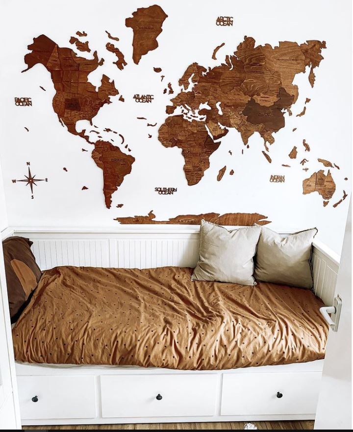3D Wooden World Map in Oak Color Over a Bed