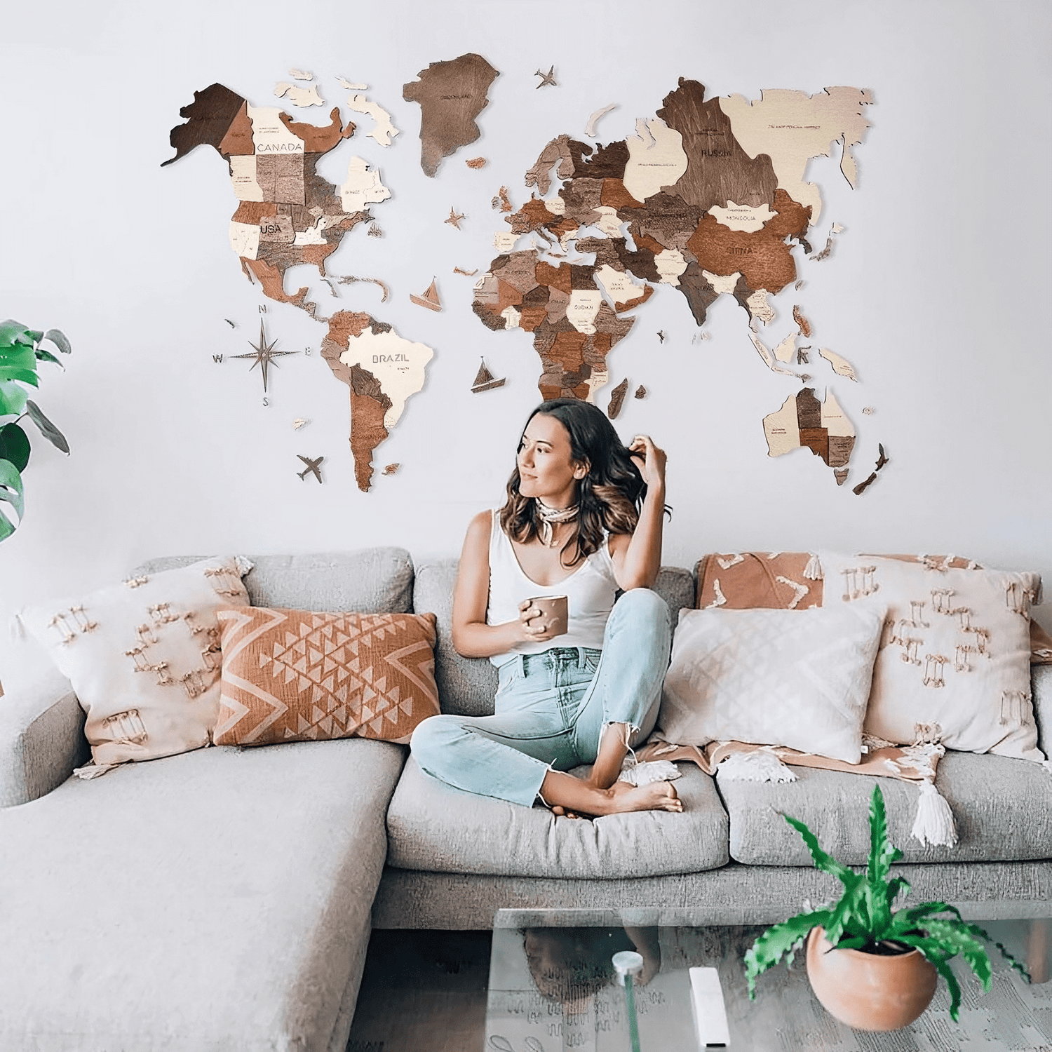 Woman Smiling with her 3D Wooden World Map in a Living Room